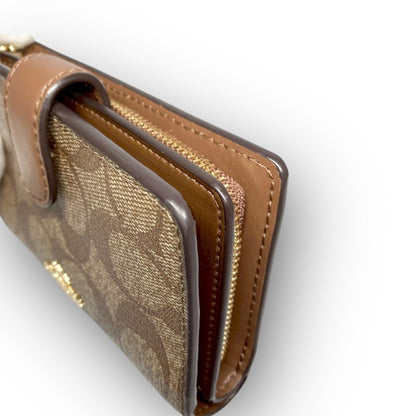 ３５ COACH コーチ 二つ折り財布 シグネチャー ブラウン